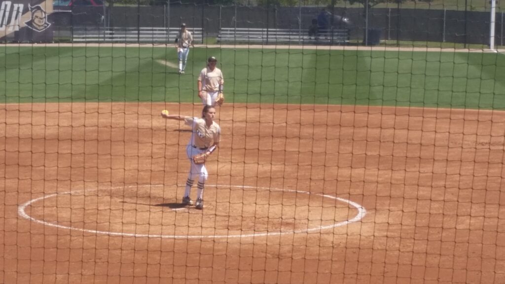 High school softball game action